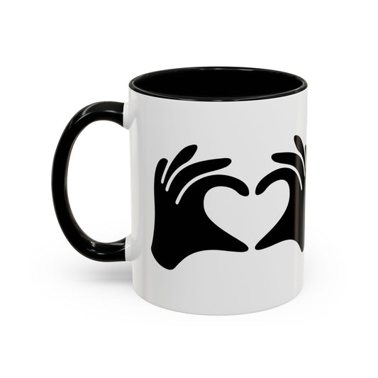 White mug with black interior and handle, featuring a black heart design on a white background