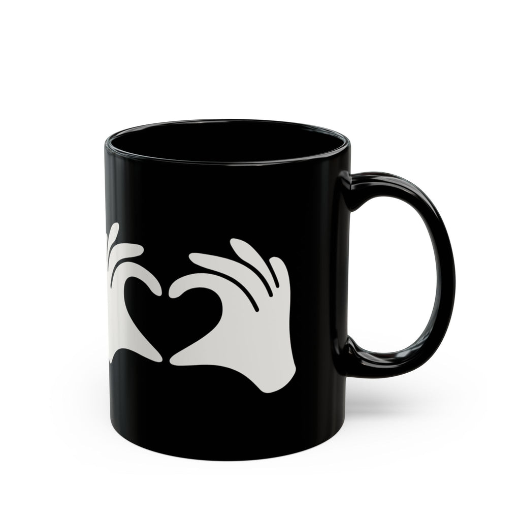 Black mug with a white heart design on a white background