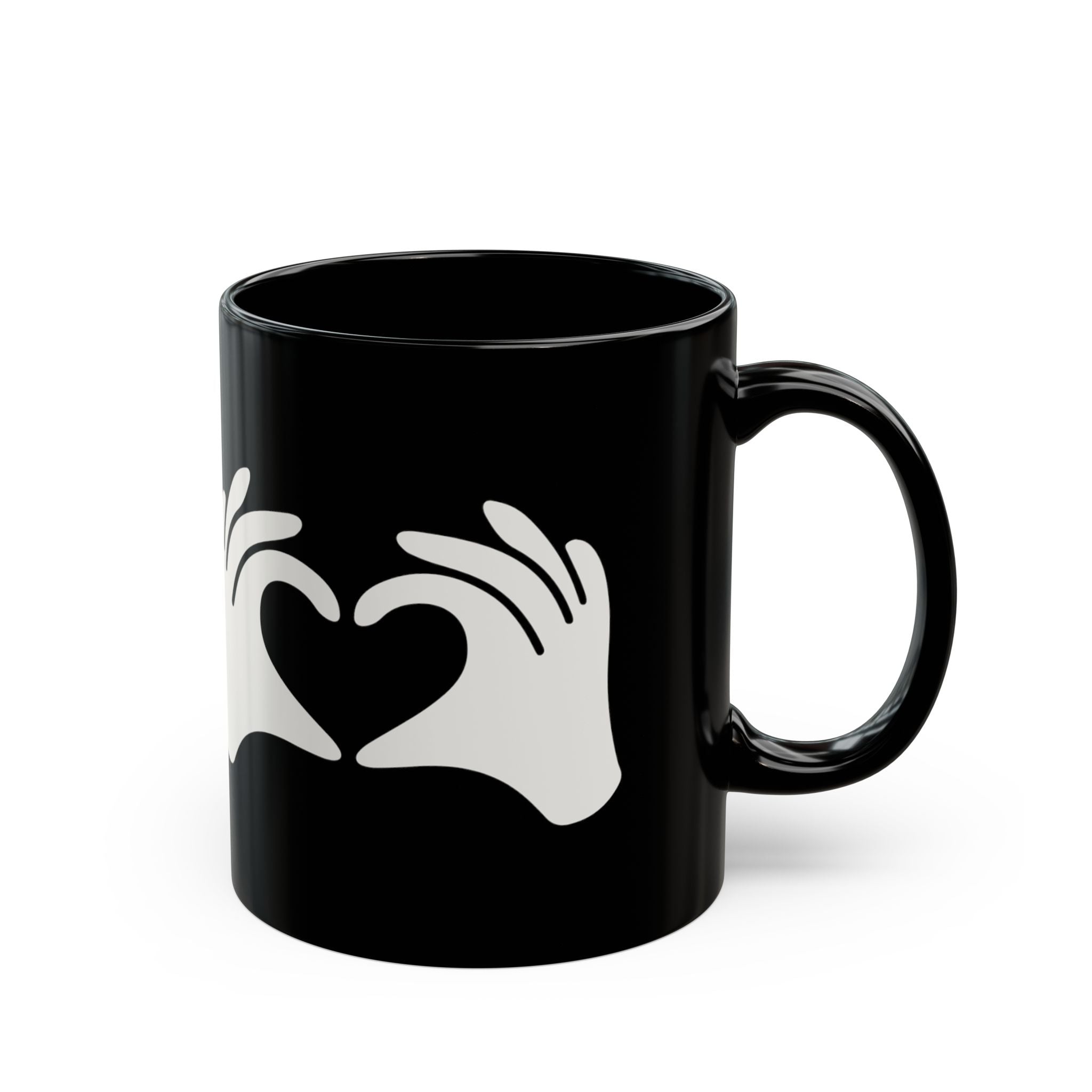 Black mug with a white heart design on a white background