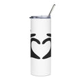 White tumbler with black heart design and metal straw on a white background