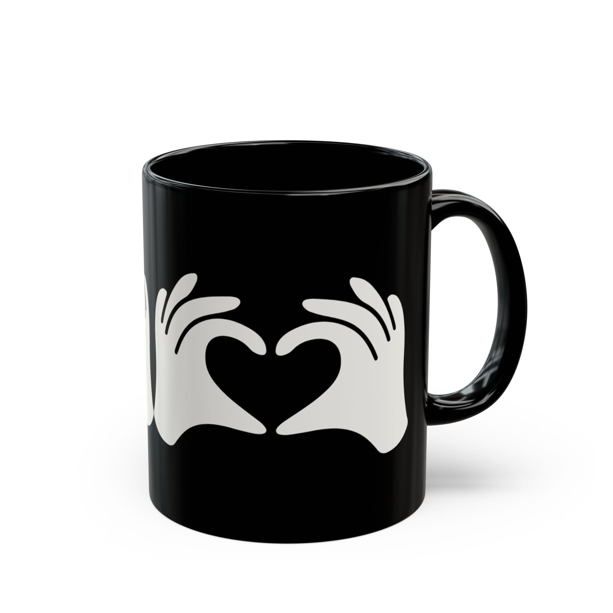 Black mug with white hand gesture design on a white background