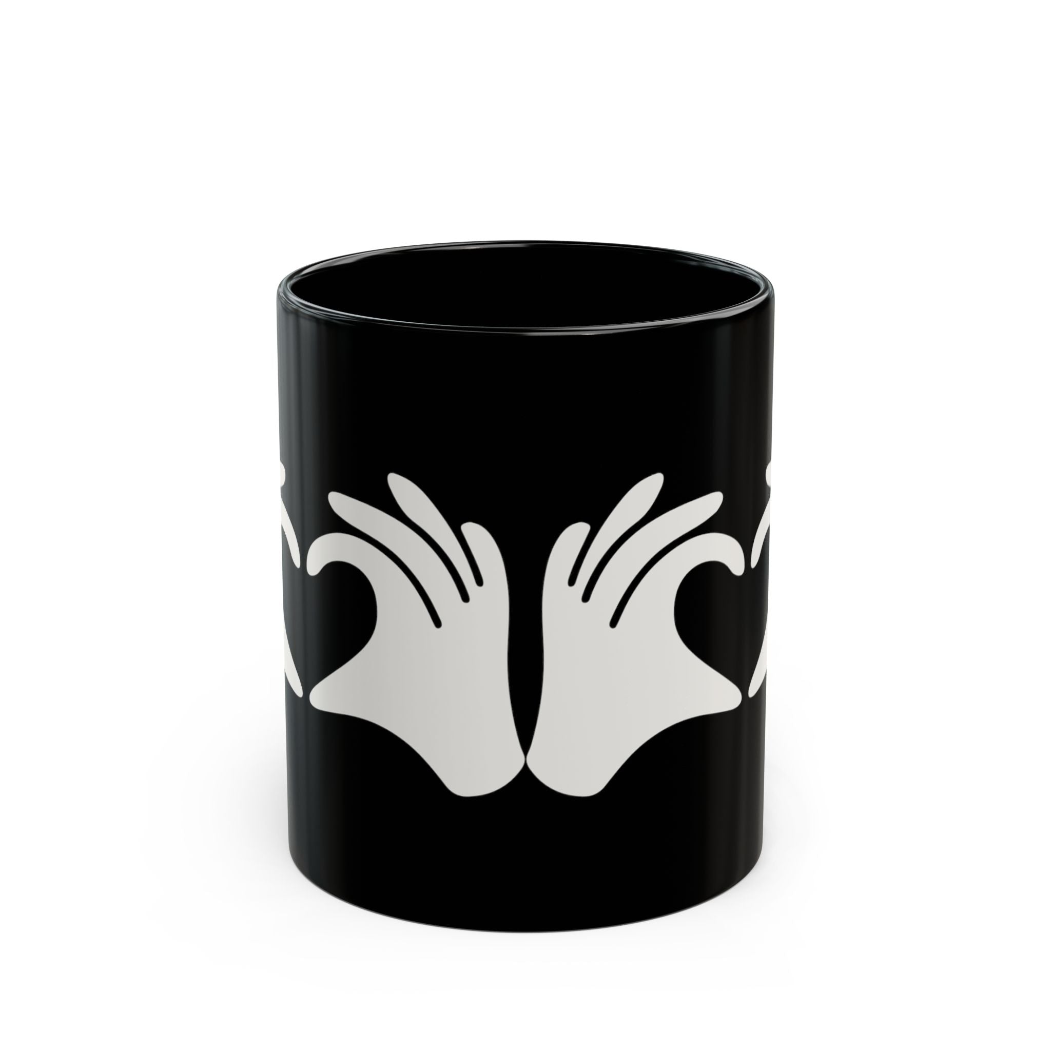 Black mug with white hand design on a white background