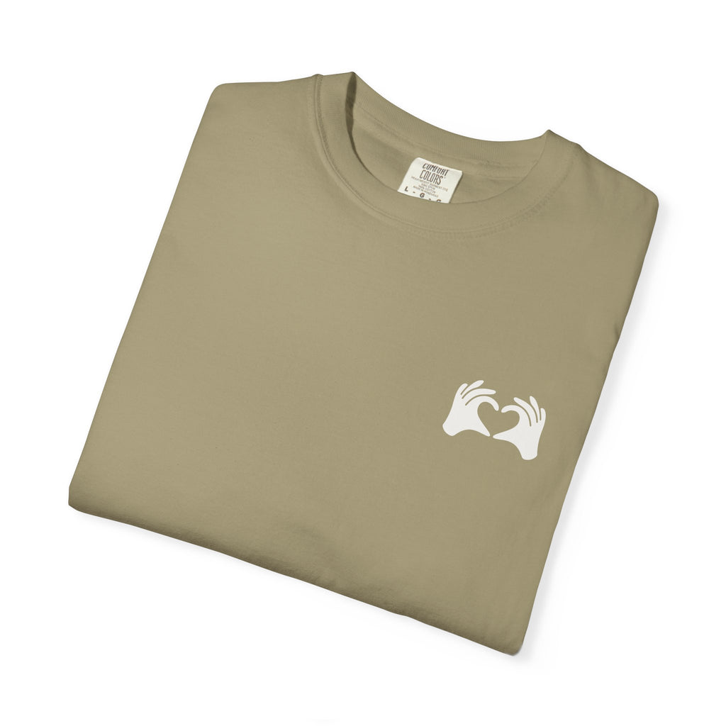 Folded gray t-shirt with a small logo on a white background