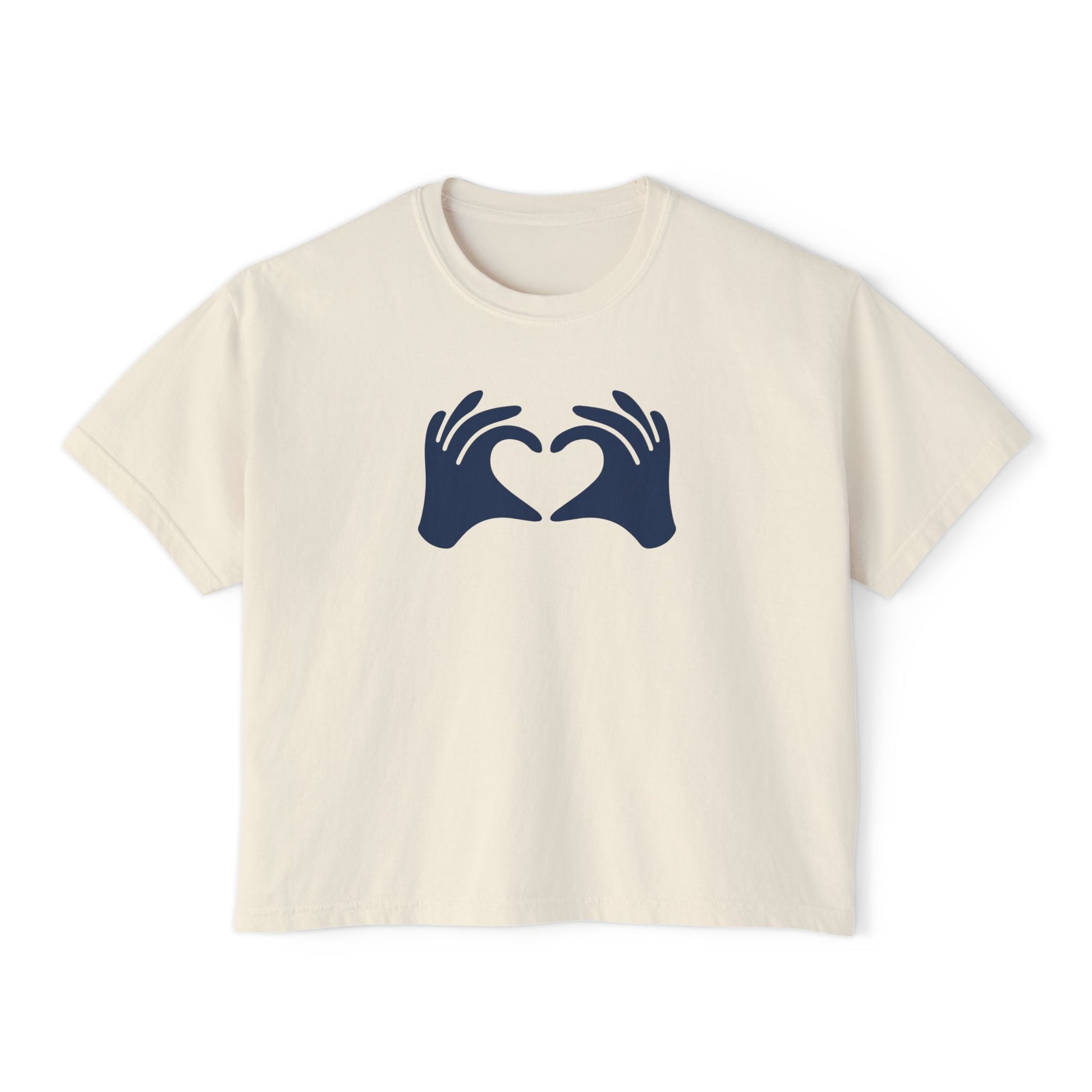 Beige t-shirt with navy blue graphic of hands forming a heart on a white background