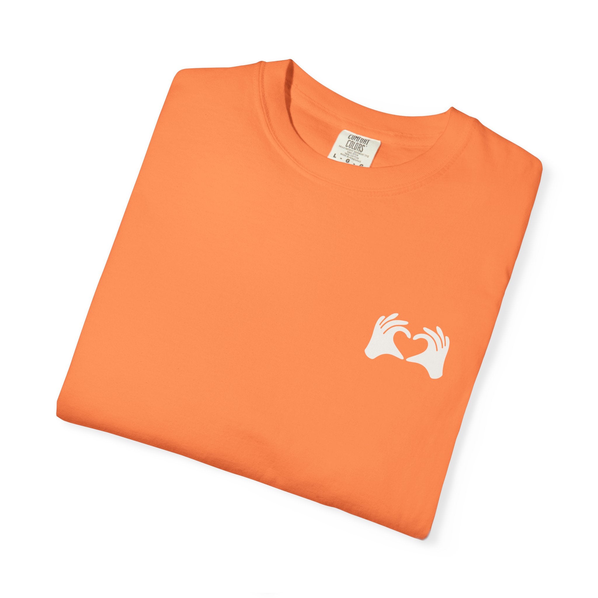 Orange t-shirt with a white logo on a white background