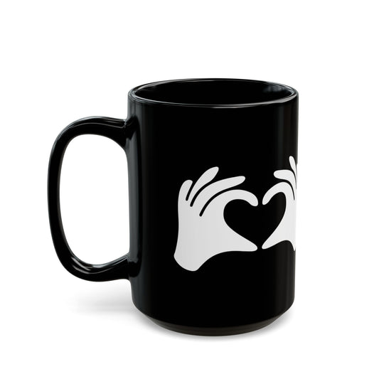 Black mug with white hand icon forming a heart on a white background