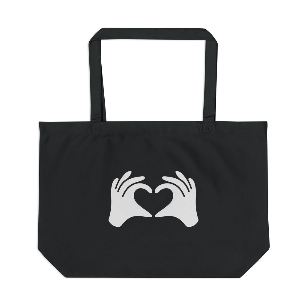 Black tote bag with white hands forming a heart design on a white background