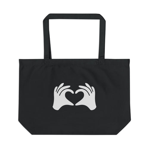 Black tote bag with white hands forming a heart design on a white background