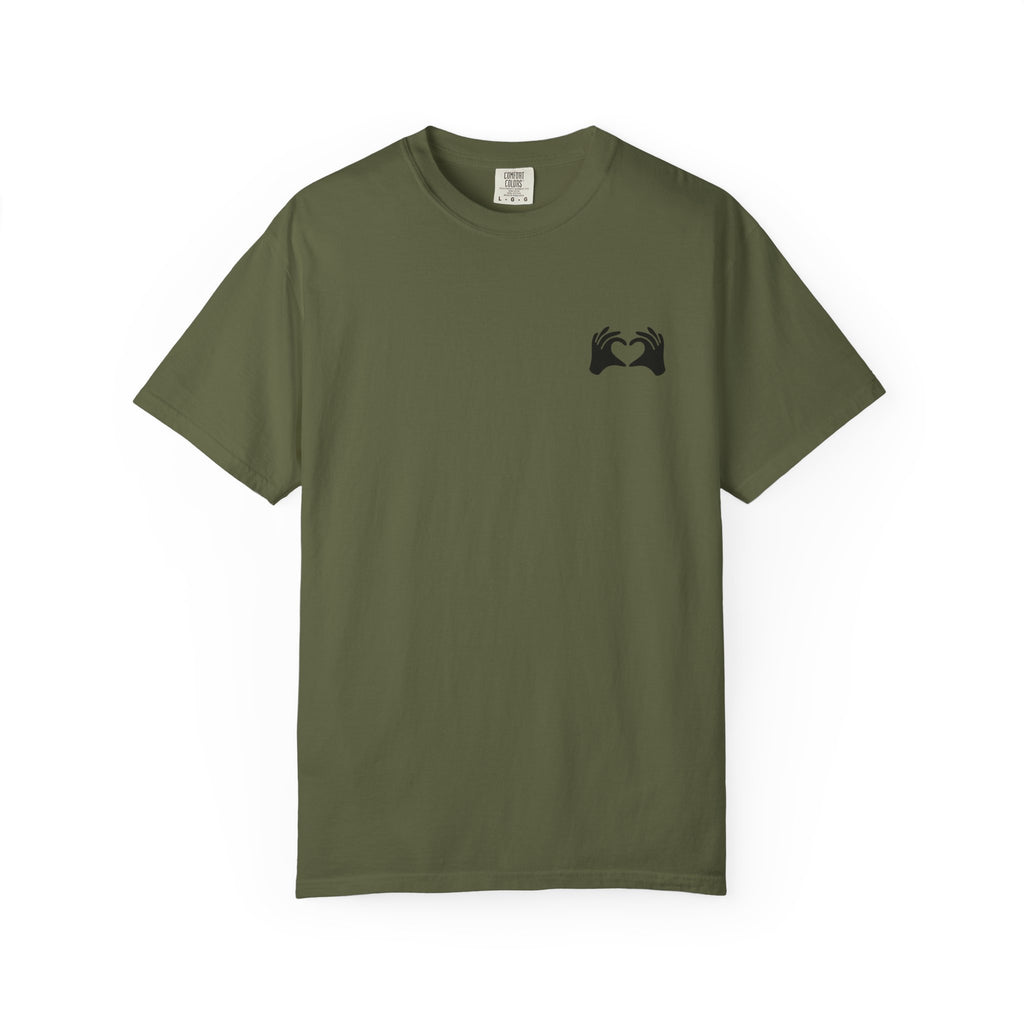 Green t-shirt with a black cross on a white background