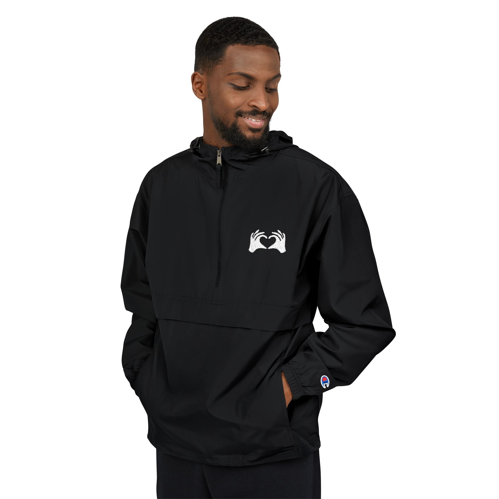 Man wearing a black hoodie with a yellow logo on a white background