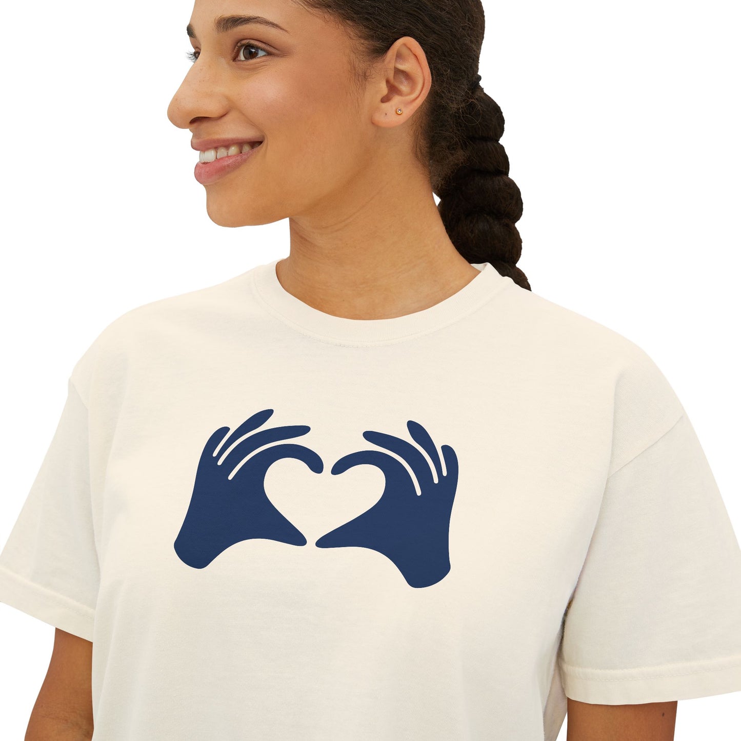 Woman wearing a white t-shirt with blue hand design on a white background