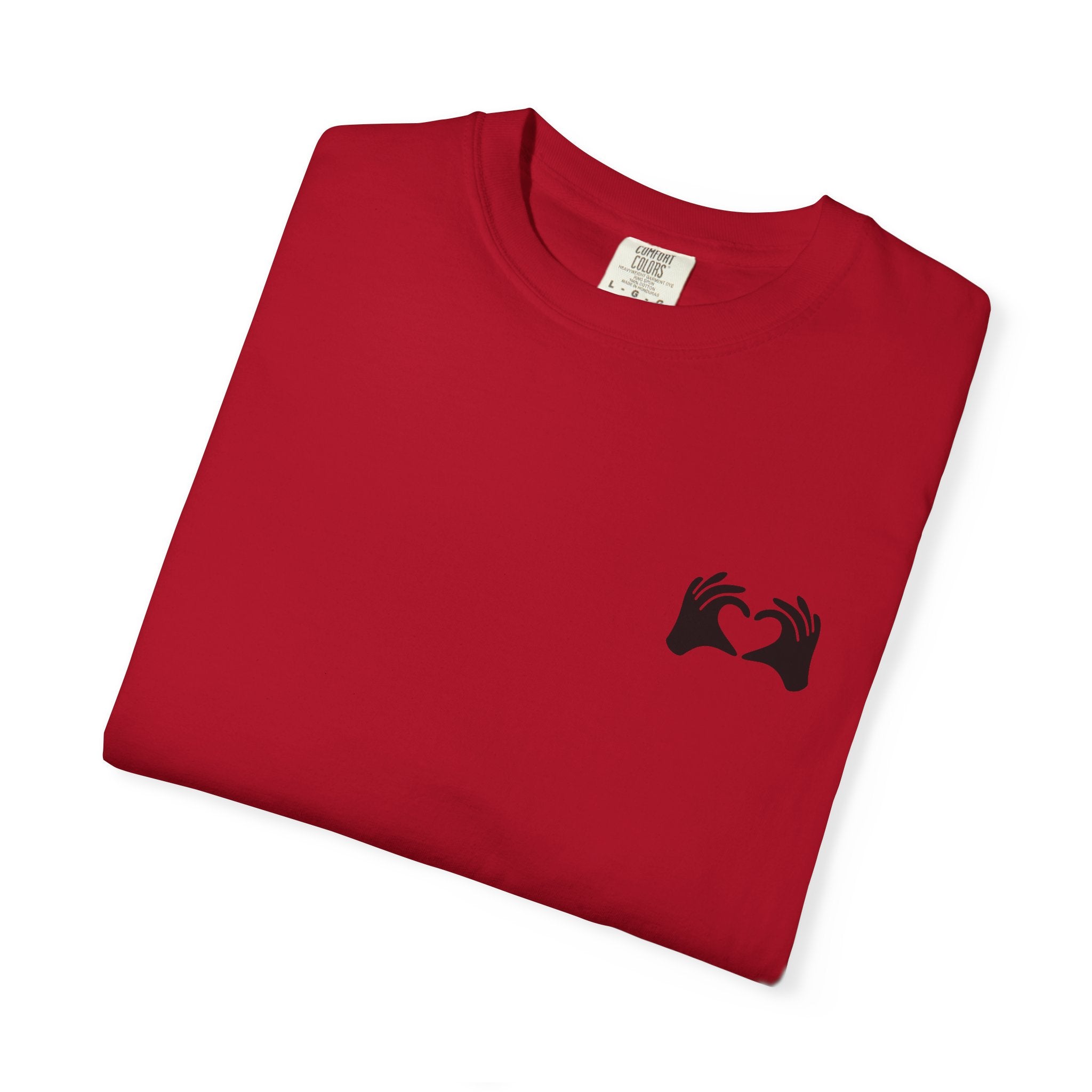 Folded red t-shirt with a black design on a white background