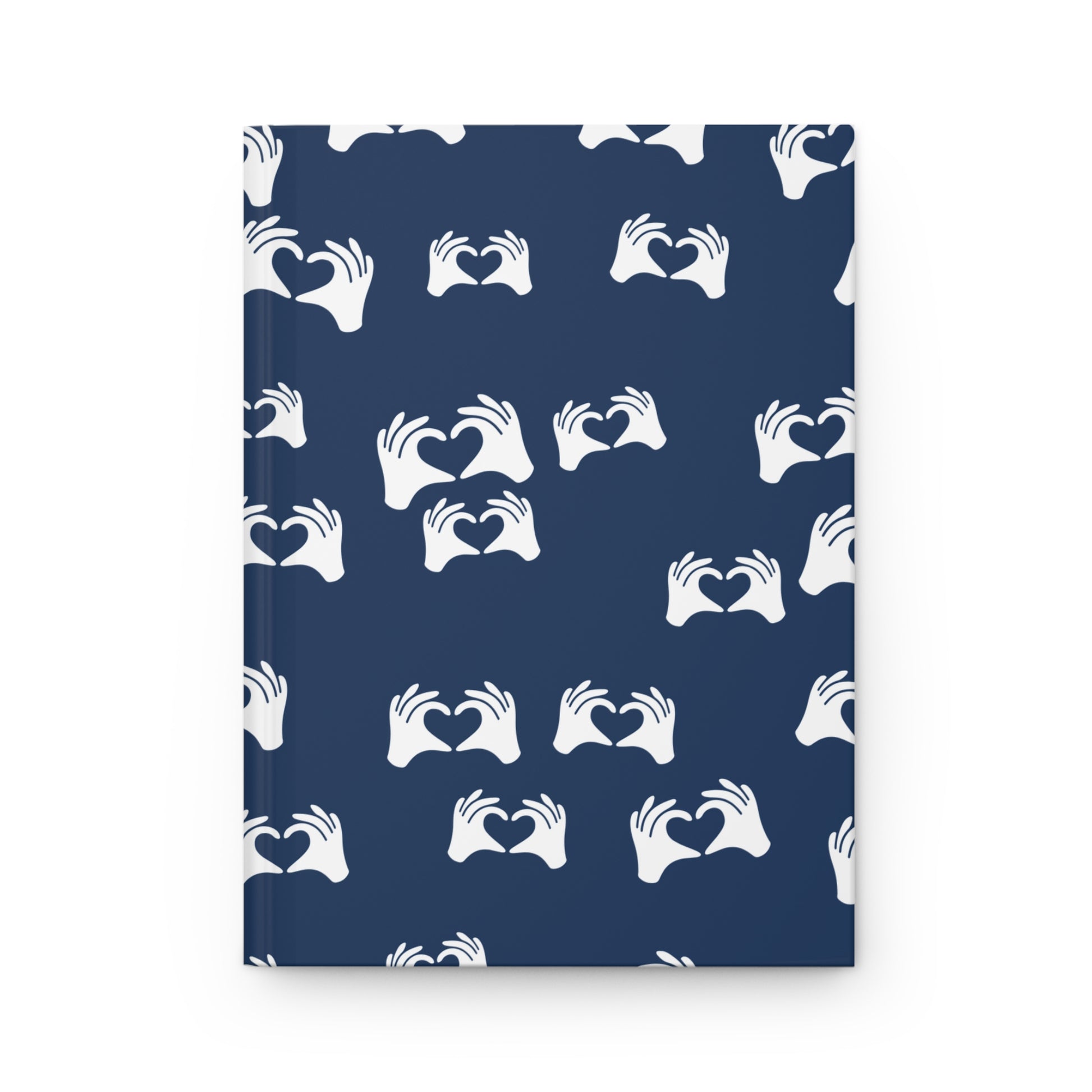 Notebook with white heart-hand pattern on a blue background