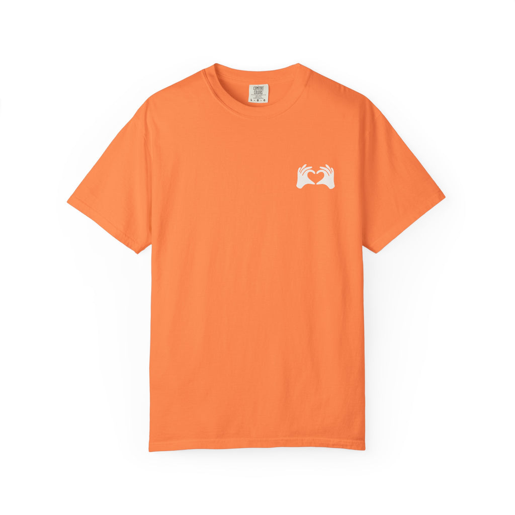 Orange t-shirt with a white logo on a white background