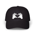Black cap with white hands forming a heart design on a white background