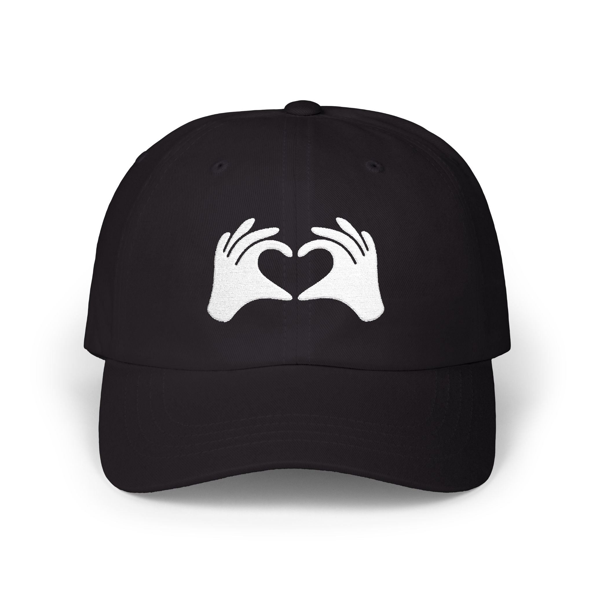 Black cap with white hands forming a heart design on a white background