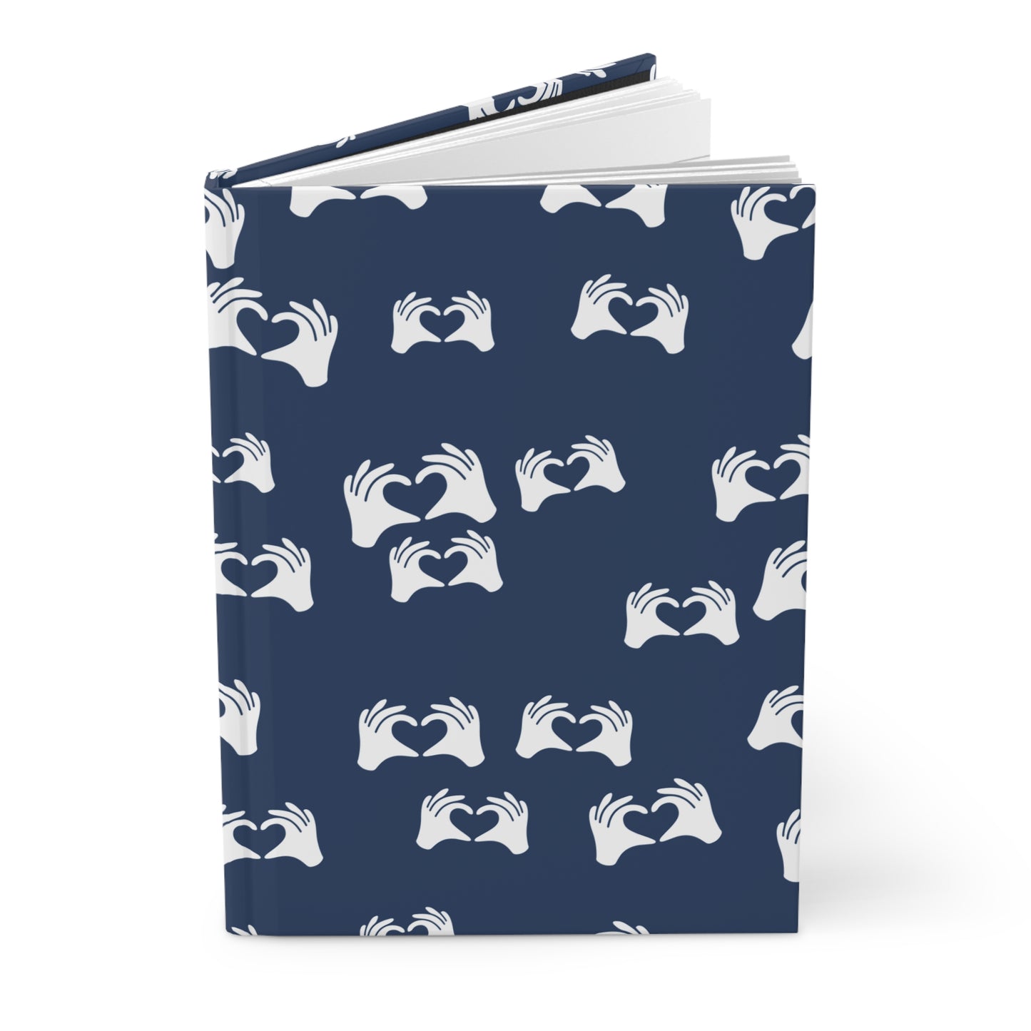 Notebook with a blue cover featuring white hand patterns on a white background