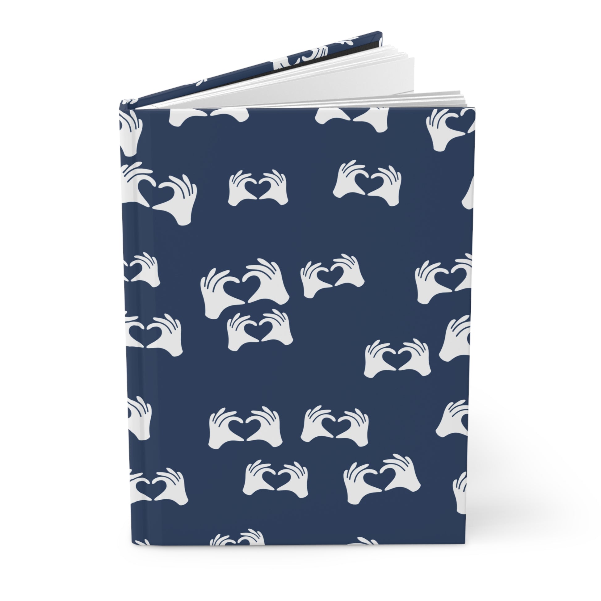 Notebook with a blue cover featuring white hand patterns on a white background