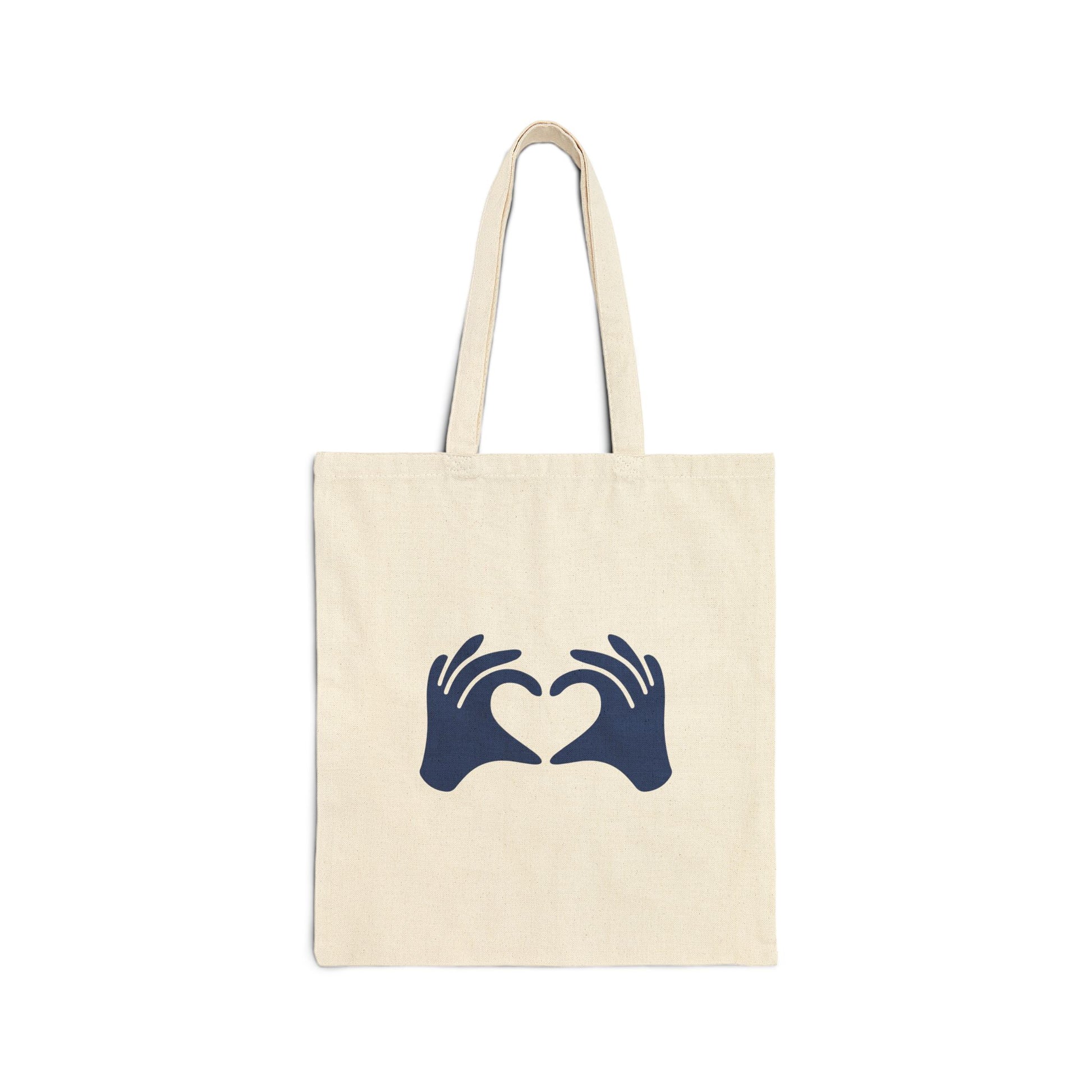Beige tote bag with blue hands forming a heart design on a white background