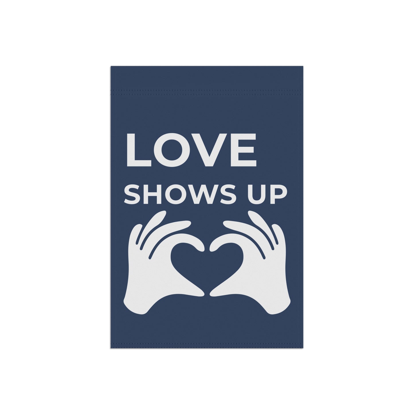 Navy blue sign with white text 'LOVE SHOWS UP' and hands forming a heart shape.