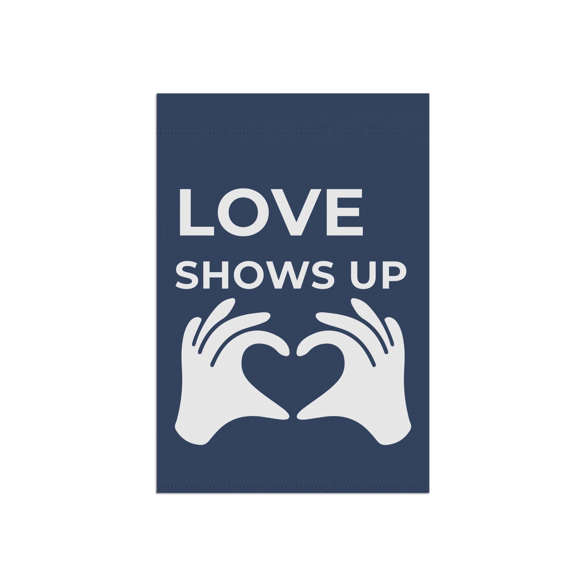 Navy blue sign with white text 'LOVE SHOWS UP' and hands forming a heart shape.
