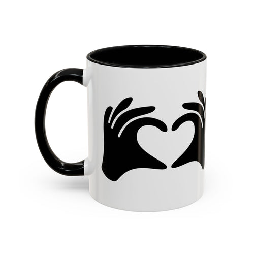White mug with black interior and handle, featuring a black heart design on a white background