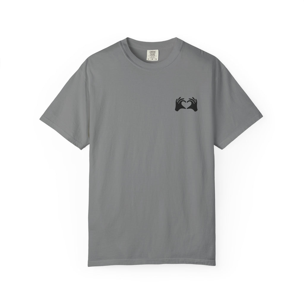 Gray t-shirt with a small colorful graphic on the chest against a white background
