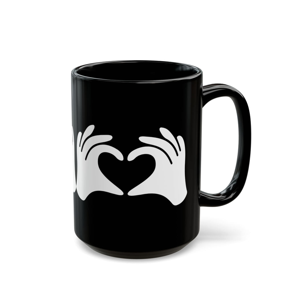 Black mug with white heart design on a white background