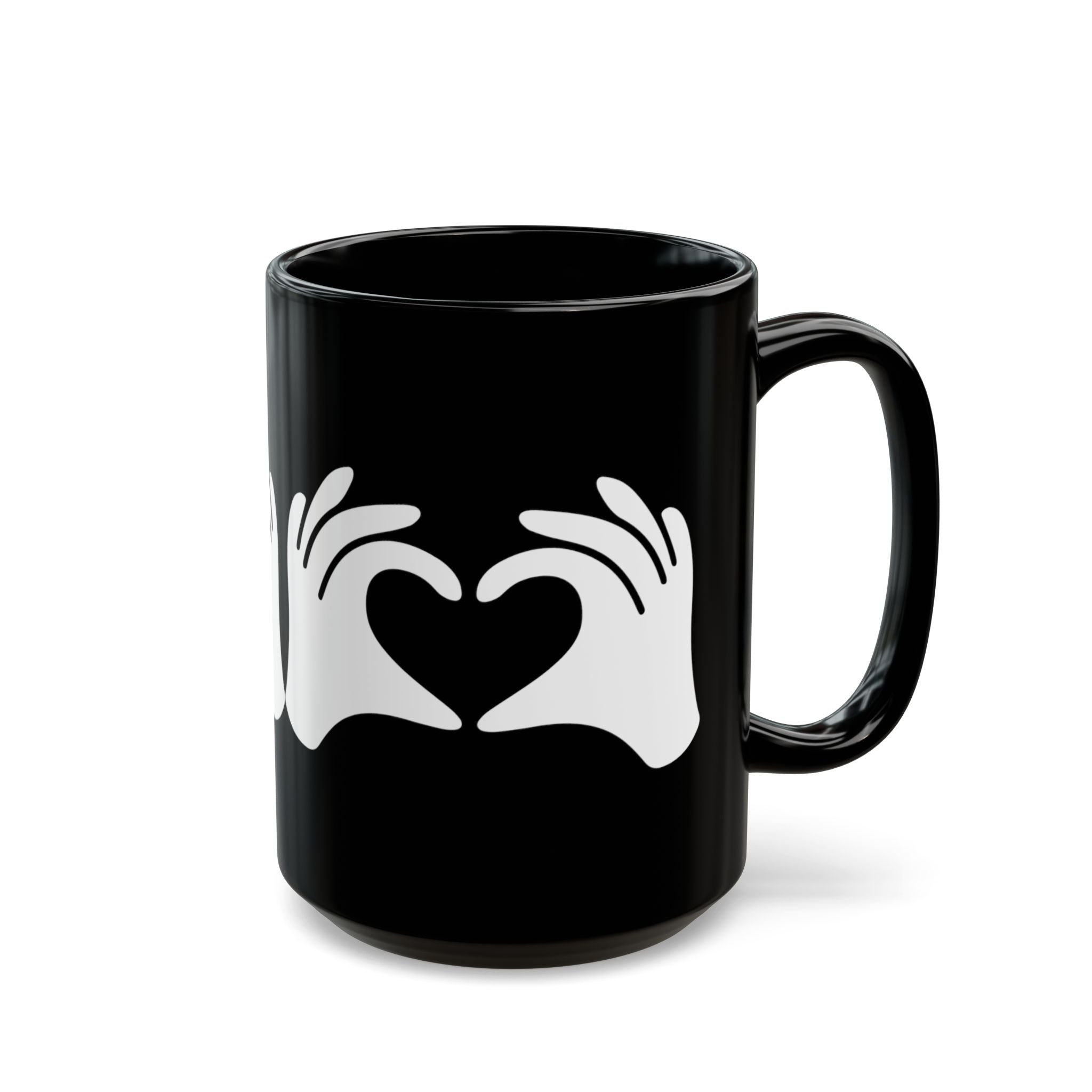 Black mug with white heart design on a white background