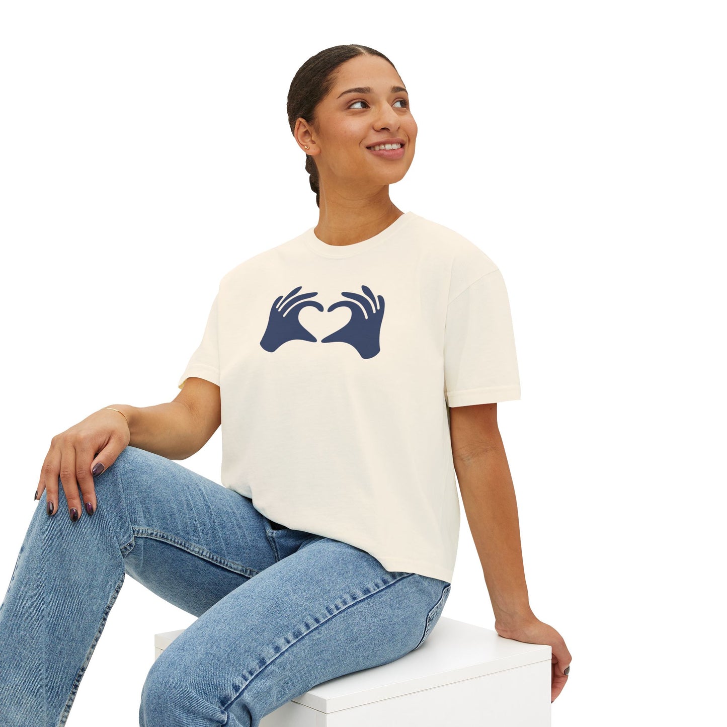 Woman wearing a white t-shirt with a blue graphic design on a white background