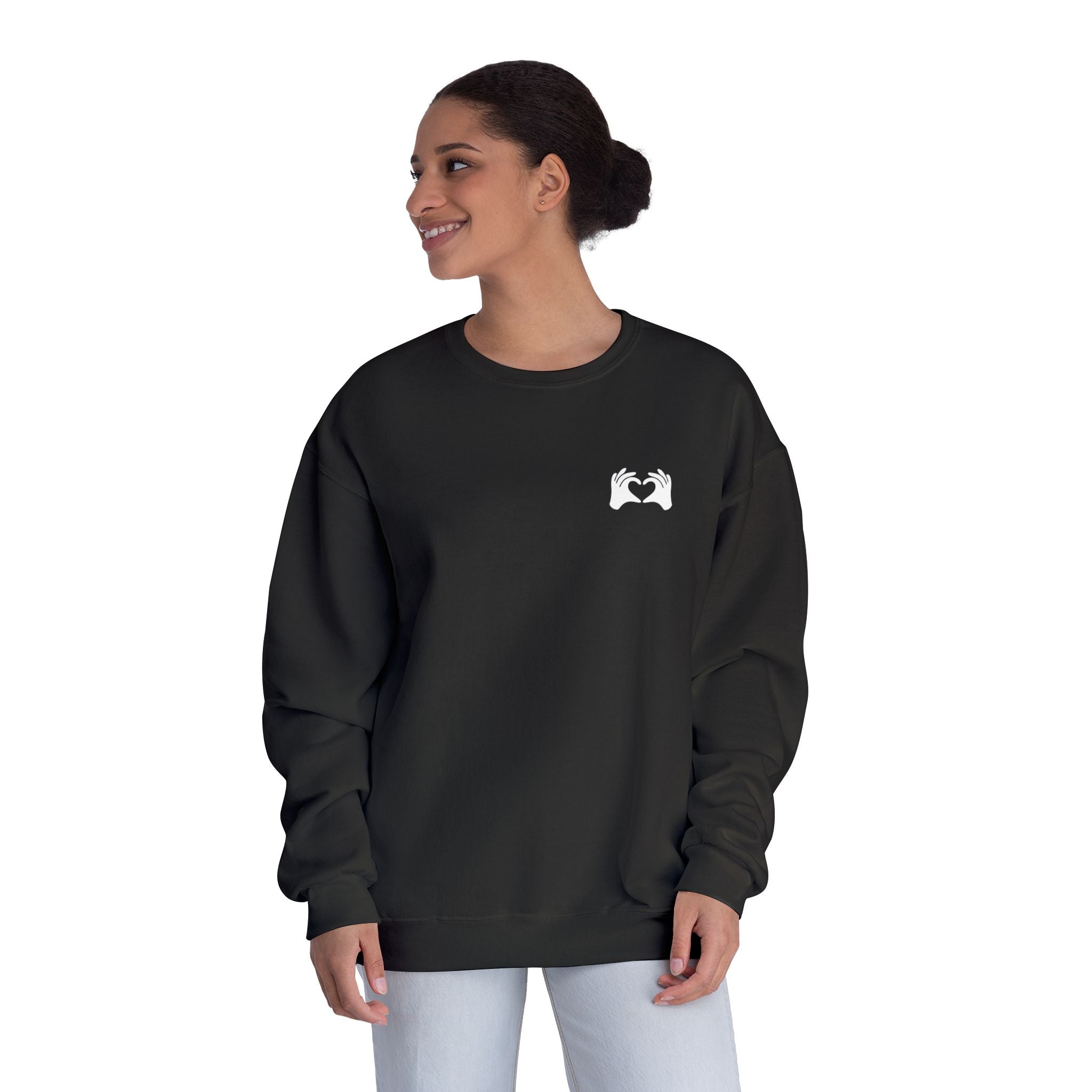 Person wearing a green sweatshirt with 'Be the Change' text on a white background
