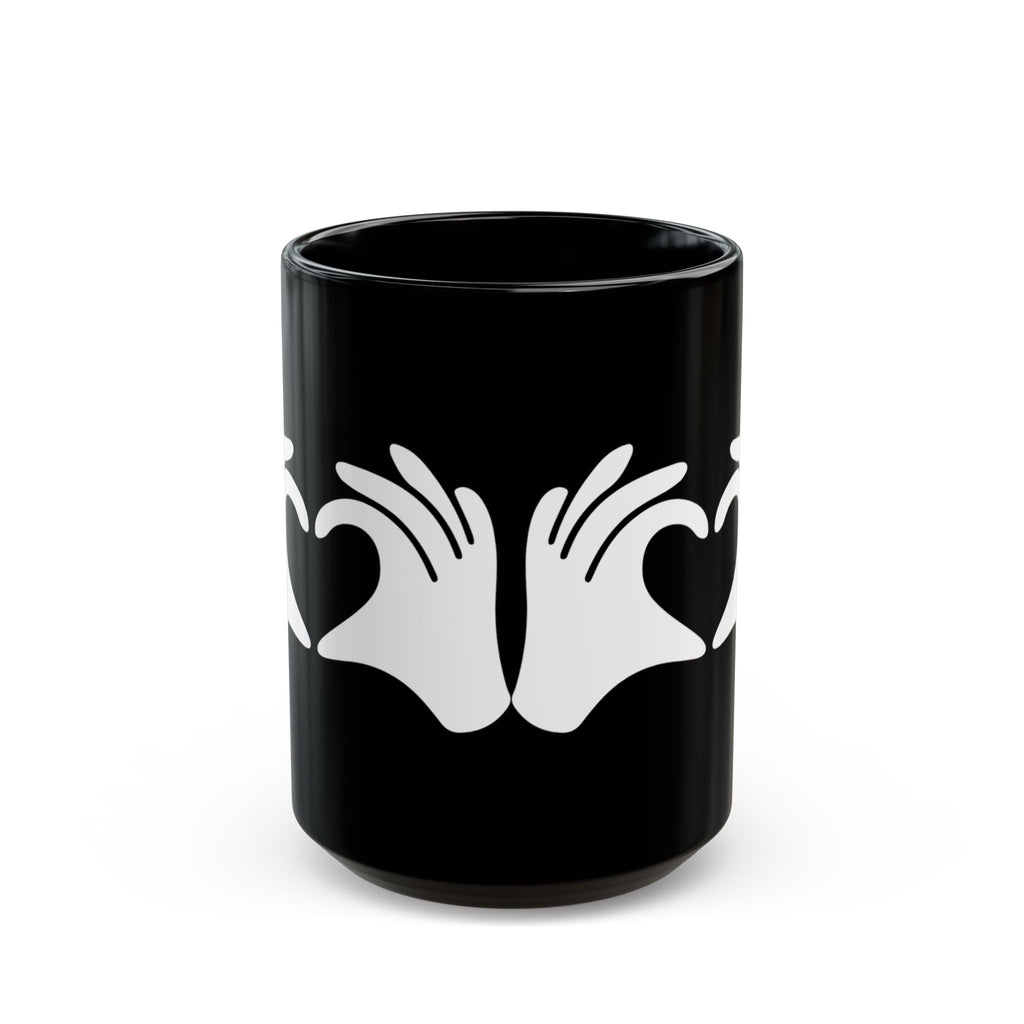 Black mug with white hand design on a white background