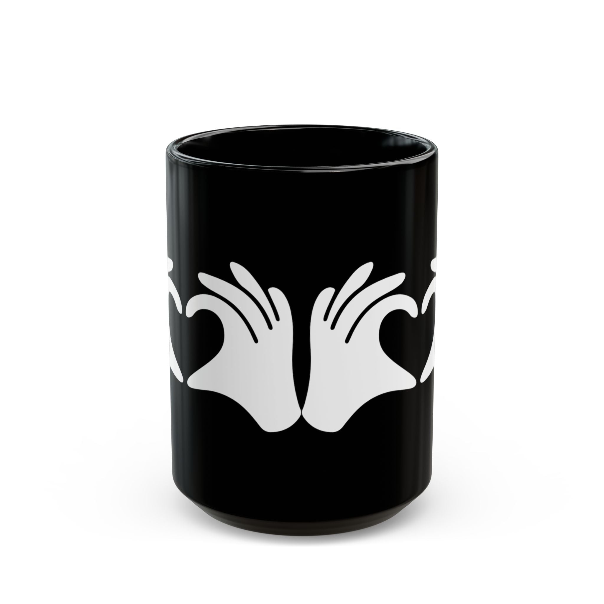 Black mug with white hand design on a white background
